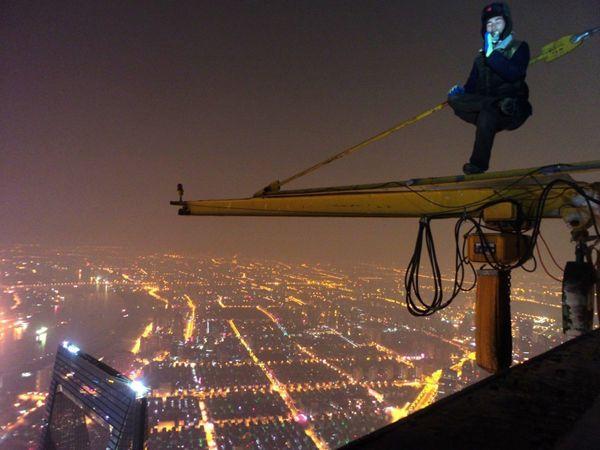 Two young Chinese men climbed to the top of the unfinished Shanghai Tower on February 20, after which, they posted online a video about their climbing process. (Photo source: xinmin.cn)