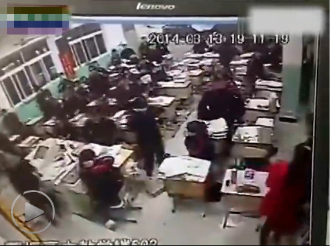 His suicide sparks panic among the teacher and students. [Screenshot of video]