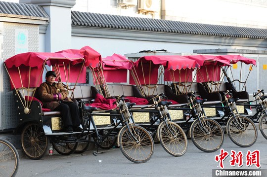 File photo shows pedicabs in Beijing <i>hutong</i>. [Photo: China News Service]