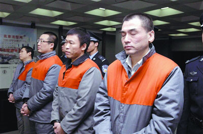 A file photo of Xia Keming(R1) and his three companions (Photo source: people.cn)