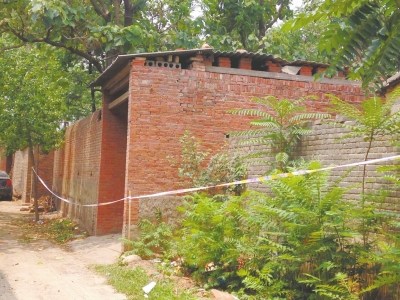 The picture shows the house where burned body parts of two kindergarten girls were hidden. (Photo source: Dahe Daily)