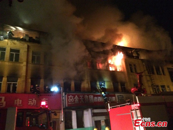 A building caught on fire in Harbin, China's Heilongjiang Province, Tuesday, June 10, 2014. [Photo/Xie Peihua]