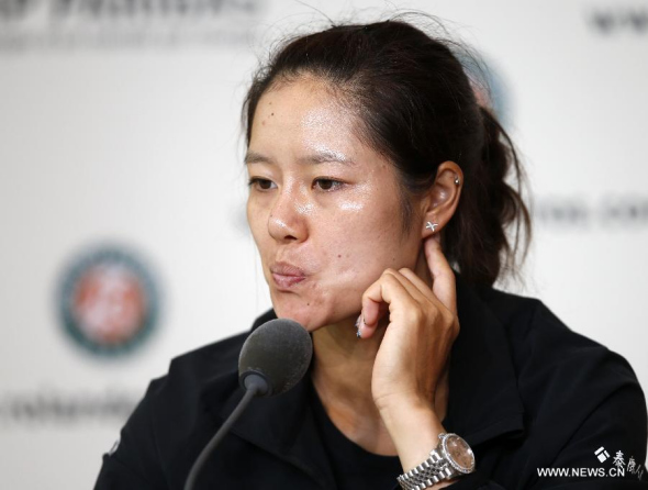 Li Na of China reacts during the press conference for her Women's Singles first round match against Kristina Mladenovic of France on day 3 of the French Open at Roland Garros in Paris on May 27, 2014. Li lost 1-2. (Xinhua/Wang Lili)