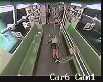 The foreigner falls to the ground as the train draws to a halt. (Photo: screen shot from surveillance video clip) 