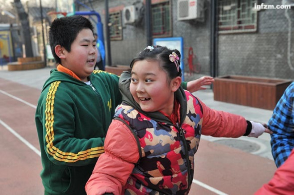 Overweighted children take exercise at a school. (Photo/Xinhua)