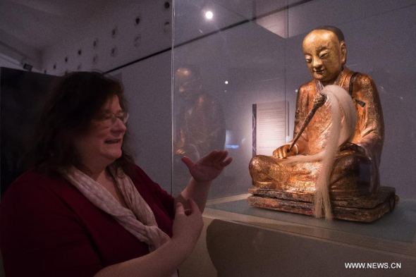 A Chinese Buddha statue with the mummified body of a Buddhist monk inside is on display at the Hungarian Natural History Museum in Budapest, Hungary on March 3, 2015.  (Xinhua/Attila Volgyi) 