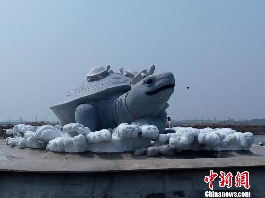 A 501-ton dark jade sculpture of a mythical turtle, which is 3.7 meters tall, 5.7 meters wide and 9 meters long, is inaugurated in Caofeidian, North Chinas Hebei province on May 3. (Photo: China News Service/Li Lianjun)
