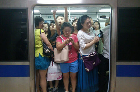 People take a subway in Beijing. (File photo)