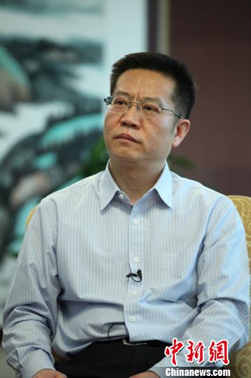 Li Beiguang, the deputy director of the Planning Department of the Ministry of Industry and Information Technology, speaks in an interview on May 19, 2015. (Photo/Chinanews.com)