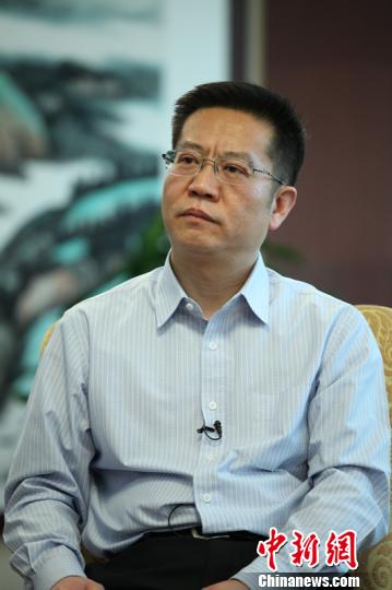 Li Beiguang, the deputy director of the Planning Department of the Ministry of Industry and Information Technology, speaks in an interview on May 19, 2015. (Photo/Chinanews.com)