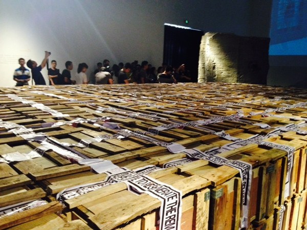 Ying Tianqi's ongoing exhibition Inquiry of the Brick in Today Art Museum features a display of thousands of wooden boxes containing old bricks. (Photo: ECNS/Qian Ruisha)