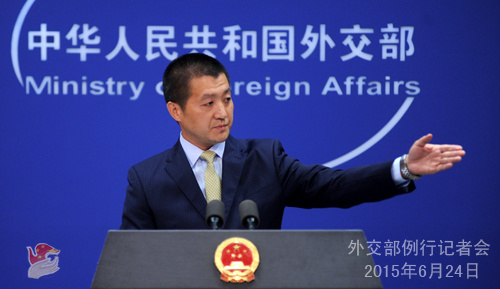 Foreign Ministry spokesman Lu Kang answers questions at a press conference on June 24, 2015. (Photo/fmprc.gov.cn)