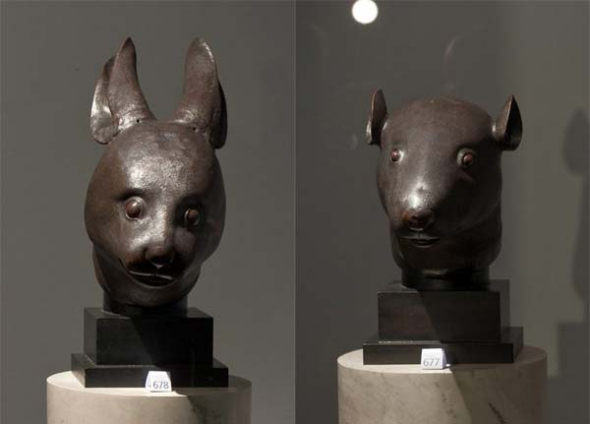Sculptures of a rabbit head and a rat head from Beijing's Yuanmingyuan Garden. (Photo provided to China Daily