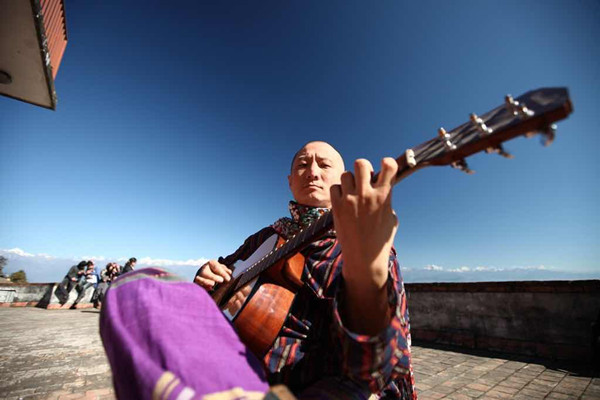 Liang plays music in Nepal in 2010. (Photo courtesy of Liang Xu)