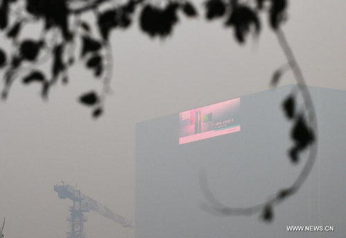 Photo taken on Nov. 8, 2015 shows a building shrouded in heavy smog in Shenyang, northeast China's Liaoning Province. (Photo: Xinhua/Yang Qing)