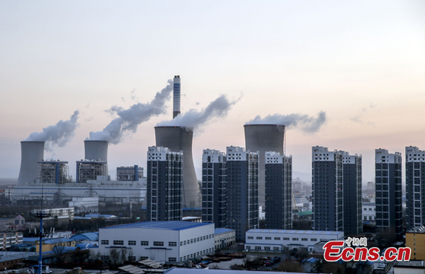 Photo shows factories and residential buildings in Hebei Province, early December, 2015. (Photo: China News Service/Zhang Hao)