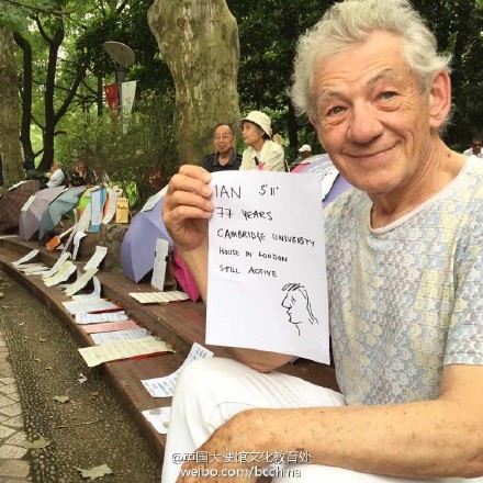Ian McKellen holds a poster with his personal information at the People's Park in Shanghai, June 11, 2016. (Photo from Weibo)