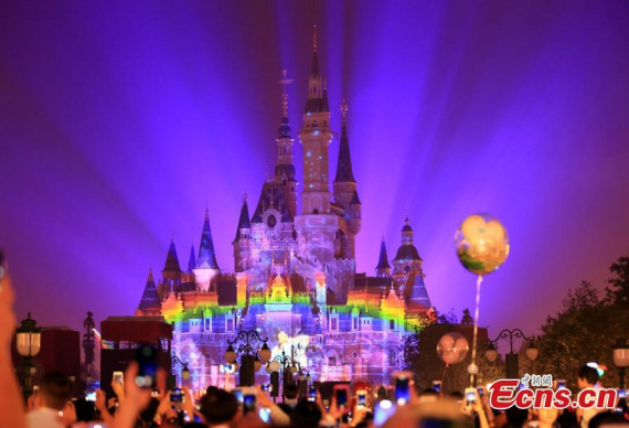 The Disneyland Forever show illuminates Shanghai Disney Resort, June 16, 2016. (Photo: China News Service/Zhang Hengwei)