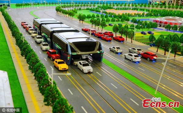 Image shows a recently unveiled design concept for a straddling bus, which lets cars drive underneath. The concept was the brainchild of the Beijing-based Transit Explore Bus, who took their design to the just-concluded high-tech expo. (Photo/CFP)