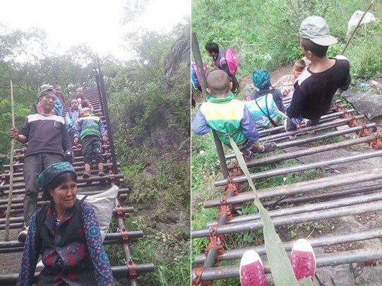 Steel-bar ladders are under construction on the cliff of Atuleer village in Liangshan Yi autonomous prefecture of Sichuan Province. (Photo/Beijing News)