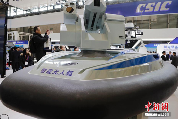 A scale model of unmanned boat is displayed at an exhibition in Shanghai, Dec. 5, 2017.  (Photo/China News Service)