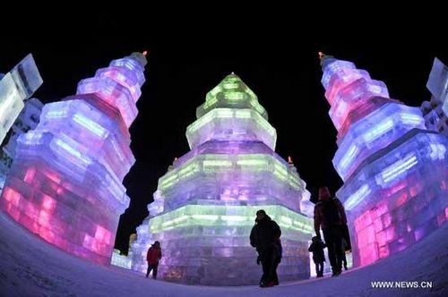 Visitors watch ice sculptures in the Ice and Snow World during the 29th Harbin International Ice and Snow Festival in Harbin, capital of northeast China's Heilongjiang Province, Jan. 5, 2013. (Xinhua/Wang Song) 