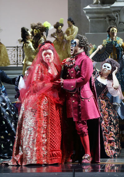 Soprano He Hui as Amelia and Dai Yuqiang in the lead role of Riccardo, duet in the National Center for the Performing Arts' opera A Masked Ball. Provided to China Daily