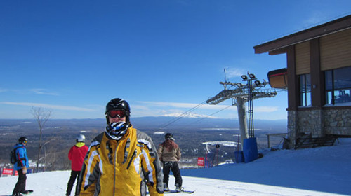 In the distance skiers can see the mountain known as Changbaishan, which means often white mountain on February 17, 2013. [Photo by Lance Crayon/chinadaily.com.cn]