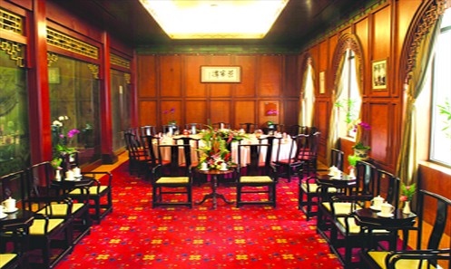 From top: the Beijing Hotel, the signature sea cucumber dish of Li's Imperial Cuisine and the interior of the Beijing Hotel dining area famous for Tanjiacai, or Tan family cuisine