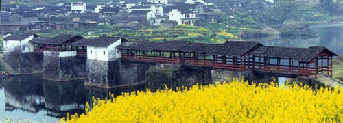 Wuyuan, in Jiangxi province, is known for its idyllic landscape and abundance of cultural relics, like this roofed bridge dating to the Song Dynasty (960-1279). Photo provided to China Daily