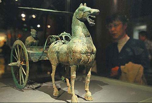 Exhibited relics and artworks reveal a vivid picture of the cultural merging of Huns and Han people. [Photo by Jiang Dong / China Daily]