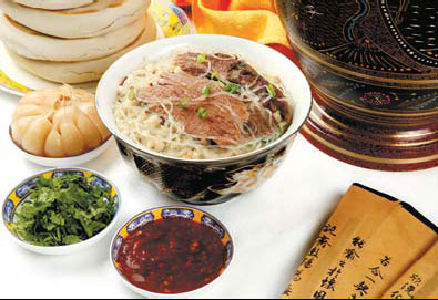 Yangrou paomo - or pita bread soaked in lamb soup - is one of the populous snacks in Xi'an. Photos Provided to China Daily