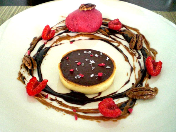 Valrhona chocolate truffle comes in a tart shell sprinkled with dried raspberries. Donna Mah / for China Daily