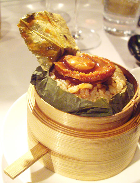 Steamed fried rice with whole Australian abalone and wild fungus served at Sing Yin restaurant in Hong Kong. Rebecca Lo / For China Daily