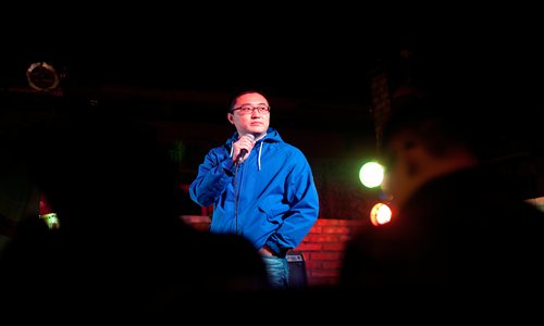 Tony Chou performs a stand-up comedy routine in Chinese on October 26 at the Hot Cat Club. Photo: Courtesy of Chou
