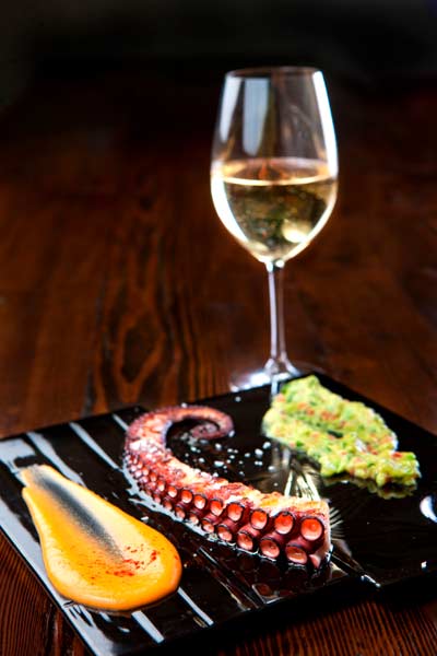 Grilled octopus with guacamole and paprika mashed potatoes. [Photo provided to China Daily]