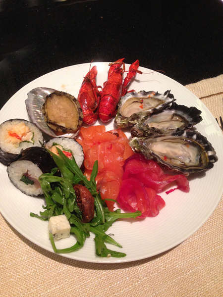 The buffet spread is a visual delight of bright colors and varied flavors. [Photo: China Daily] 