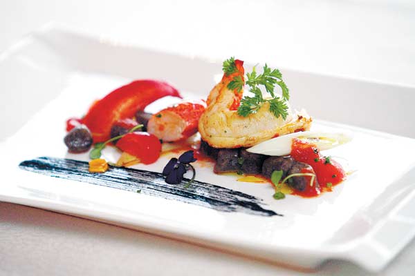 Black-olive gnocchi with fresh lobster highlights the winter menu. 
