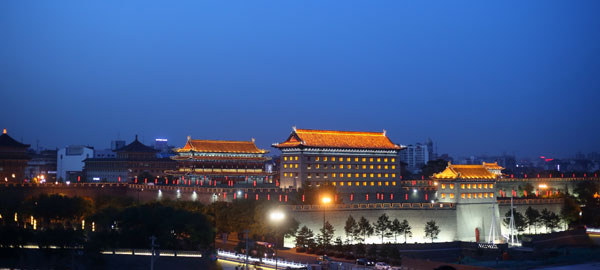 Xi'an in Shaanxi province offers visitors beautiful night views of the country's the most complete city wall. [Photo by Wang Jing/China Daily]