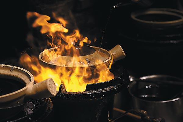 Wisca is famous for its quick-fire clay pot, with seasoned ingredients heated on a very hot fire until the pot cracks. Provided to China Daily 