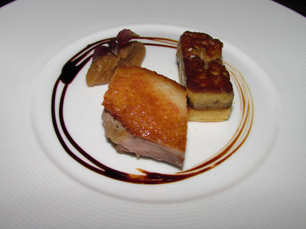 The seared duck breast and foie gras with confit apple and balsamic reduction is rich in flavor. [Photo by Donna Mah/For China Daily]    