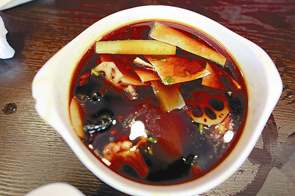 Beijing's Shuangliu Grandma's Rabbit Head, a well-known restaurant is devoted to making this exotic dish. Rabbit is not just a tasty meat, it is also a healthy one. Dietitians say domesticated rabbit meat is high in protein, but low in calories and cholesterol compared with pork and chicken. [Photo by Feng Yongbing/China Daily]