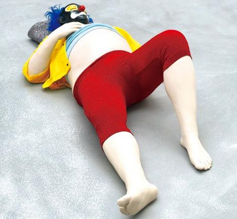 One of the 40 clowns in Ugo Rondinones artwork Vocabulary of Solitude lies on the ground of the exhibition venue.