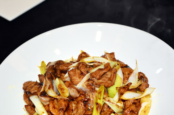 Han Ping, 56, teamed up with a hotel restaurant to showcase home cooking in Beijing. [Photo provided to chinadaily.com.cn]  