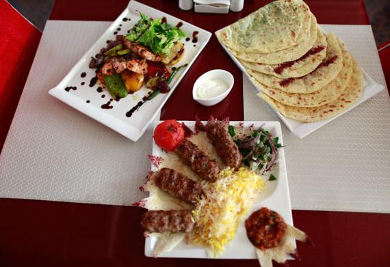 Minced lamb (front), salmon (top left) and shuarma filled with meat or vegetables are mainstays on the Caspi menu. (Photo by Feng Yongbin / China Daily)