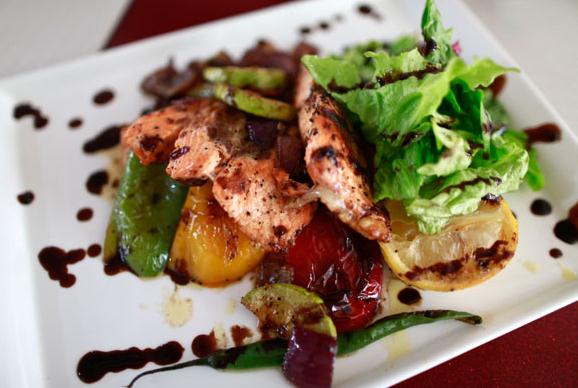 Salmon steak with vegetable (Photo by Feng Yongbin / China Daily)  