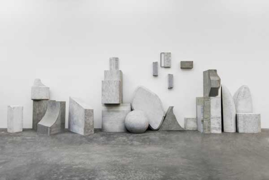 Liu Wei stands among his work Love It, Bite It in his solo show Color in Beijing, where the exhibition rooms are filled with large installations. Photo provided to China Daily  