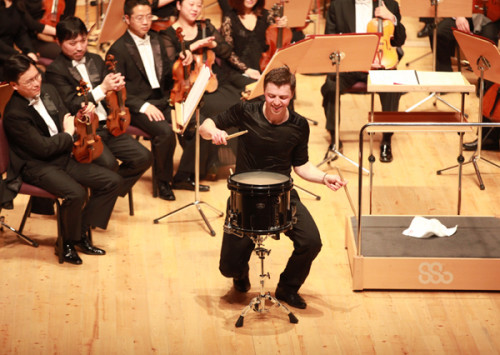 Austrian percussionist Martin Grubinger joins hands with Tan Dun to present Tan's concerto The Tears of Nature in China. Photo provided to China Daily  