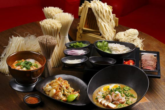 The 25th-floor bar Flair atop the Ritz-Carlton, Pudong in Shanghai offers a grand river view and Malaysian-style handmade noodles. (Photo provided to China Daily)