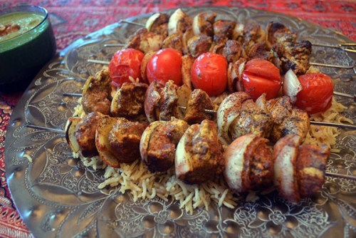 Chicken kebabs with cinnamon and black pepper with a side of Afghan cilantro sauce. Photo by Mike Peters/China Daily